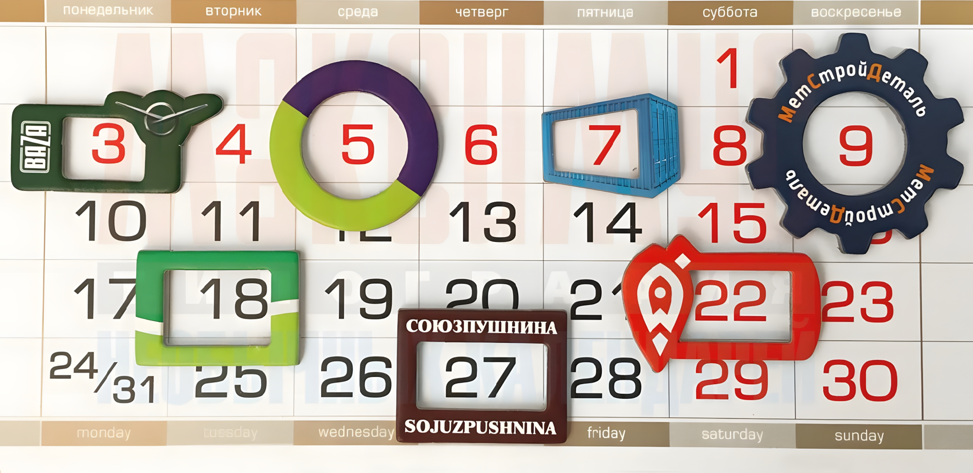 Календарь с крупными разноцветными курсорами разных форм, выделяющими отдельные даты, на фоне стандартной сетки месяца